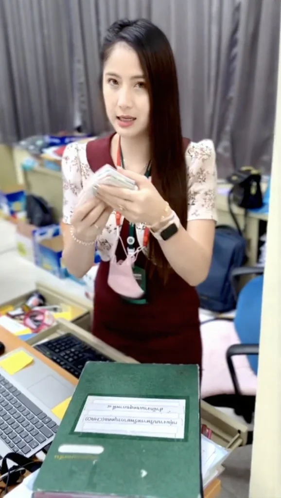 A close-up shot of the handful of official Thai government lottery tickets that led to the woman's life-changing financial freedom.