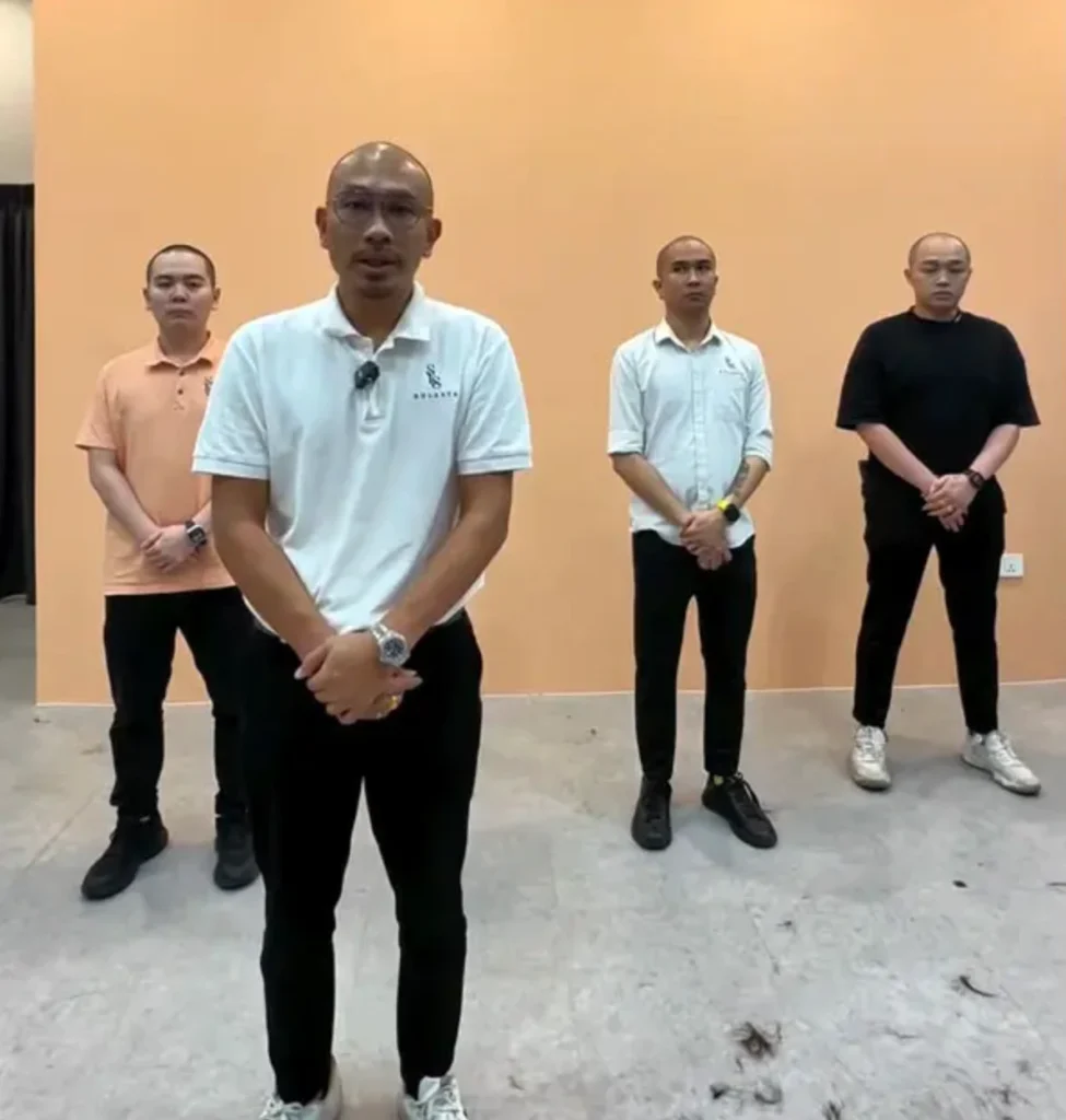 The barbershop owner, Cheong Kok Fai, speaking during an interview, explaining the sincere intentions behind the public apology