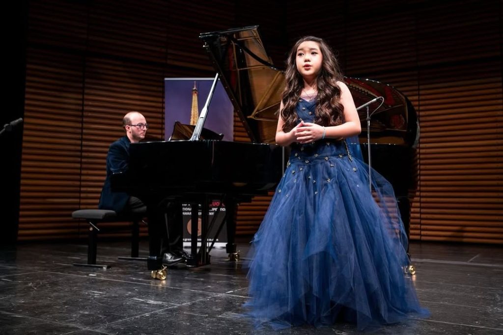  Taylor Louise holding First Prize and Exceptional Young Talent awards at Opéra Bastille