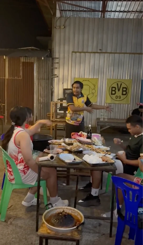 Customers enjoying Thai BBQ Mookata at a restaurant late at night past closing time