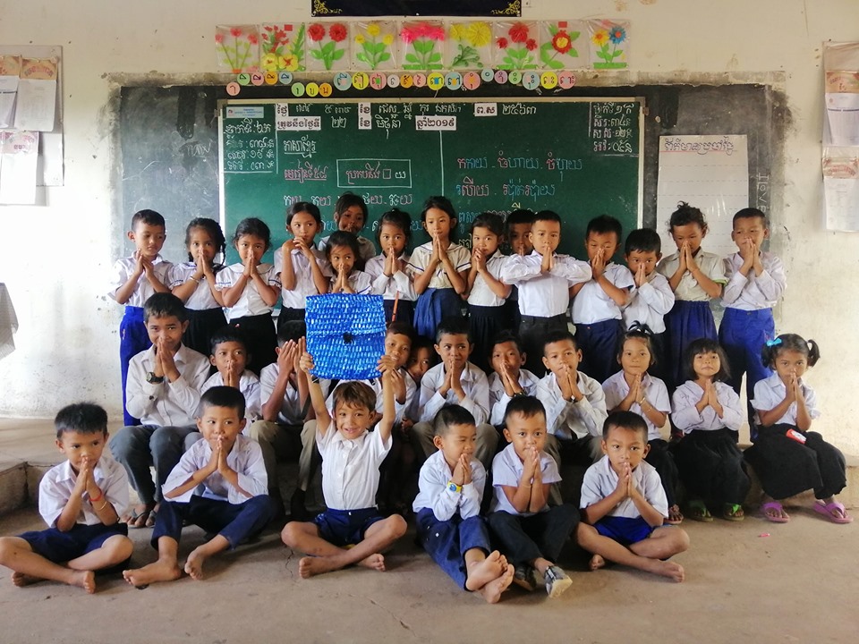 "Cambodian primary school class with teacher Sophous Suon and NY Keng's viral handmade blue school bag"