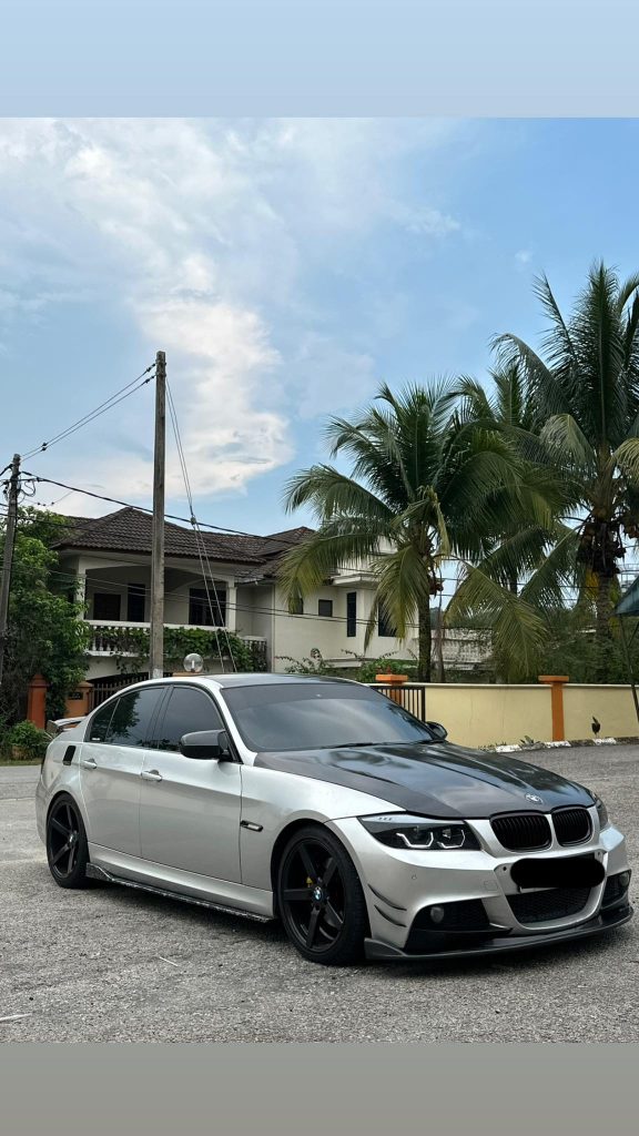  Rear view of the white BMW vehicle that the devoted husband is selling to support his family during a medical crisis