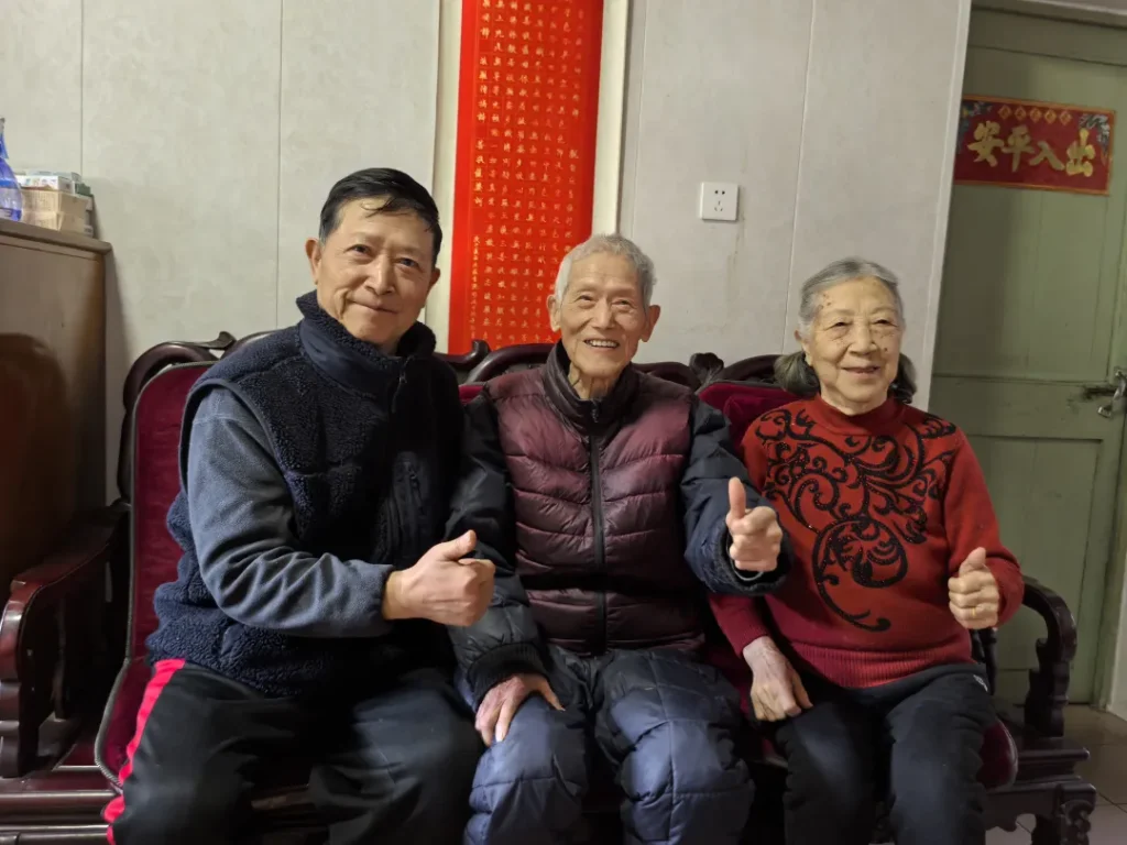 "Happy elderly couple with their eldest son"