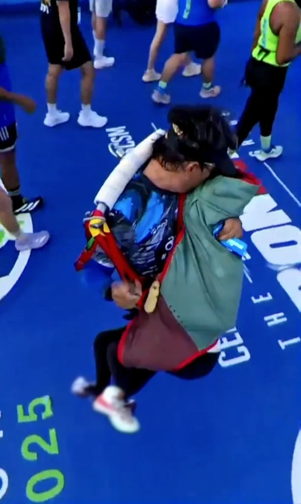 An inspiring photo of Wira Rabu and his daughter Dihan posing with their race medals, celebrating their incredible achievement.