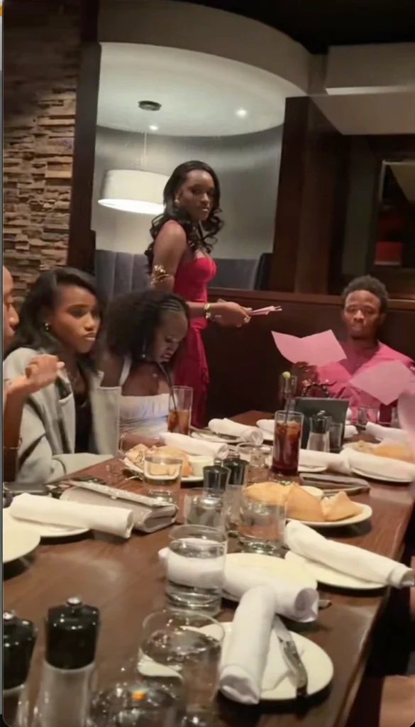 "Friends seriously attempting to solve calculus questions at birthday dinner Nigeria"