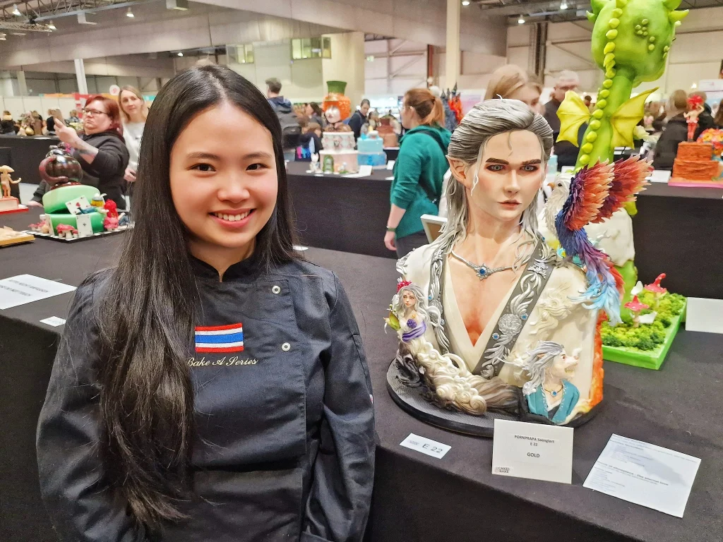 Full view of the Gold Medal winning 3D cake 'The Eternal Love' by Saenglert Ponprapa, featuring intricate ancient Chinese fantasy characters and mythical scenery at CAKE & BAKE Germany