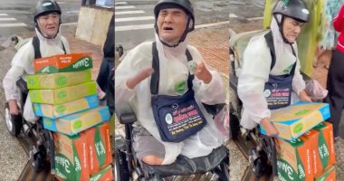 "Mr. Dũng, a disabled elderly lottery ticket seller with no arms and no legs, arrives on his electric wheelchair carrying cartons of instant noodles and milk for flood victims in Đắk Lắk, December 2025"