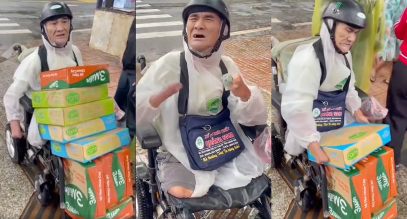 "Mr. Dũng, a disabled elderly lottery ticket seller with no arms and no legs, arrives on his electric wheelchair carrying cartons of instant noodles and milk for flood victims in Đắk Lắk, December 2025"