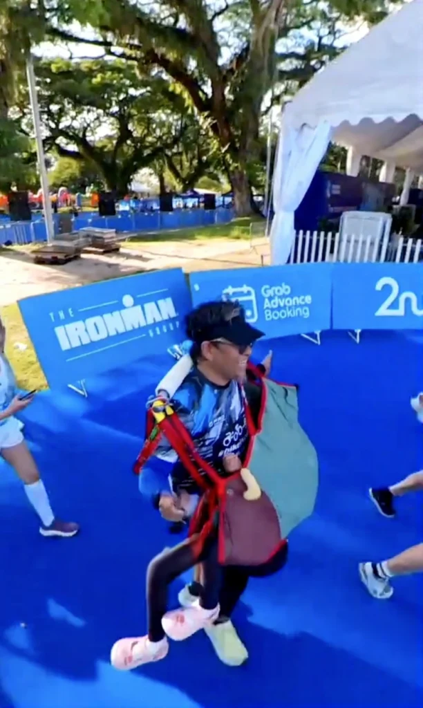 Father and daughter duo, Wira and Dihan, proudly display their finisher medals after completing the Singapore half marathon together.